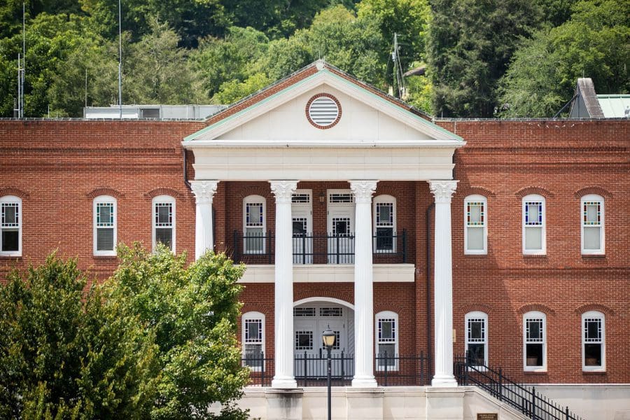 A brick building with large columns