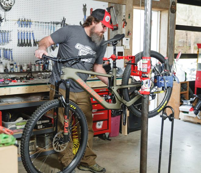 a man fixing a bike