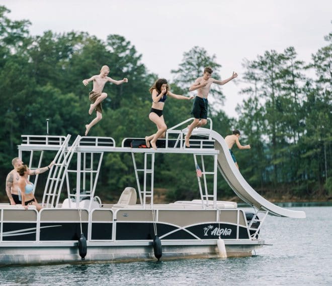 A family enjoying time on a lake in a boat