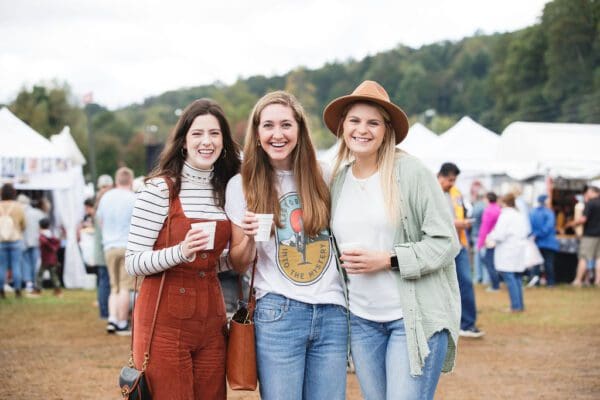 a couple enjoying food at the Apple Festival