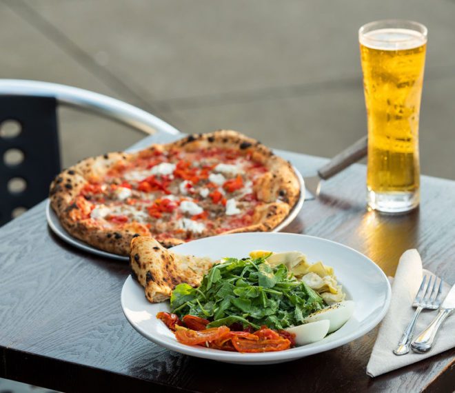 a pizza, beer, and a salad
