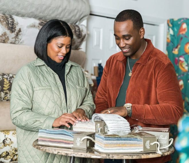 a couple looking at various fabric samples