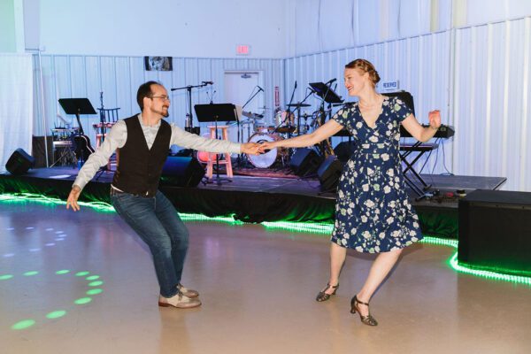 a man and woman swing dancing