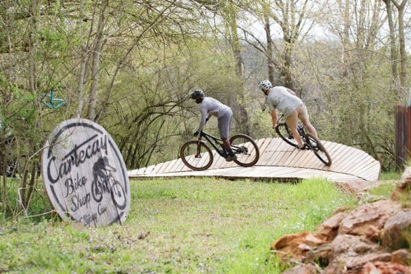 people mountain biking