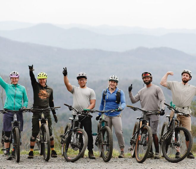 a group of friends celebrate a biking run