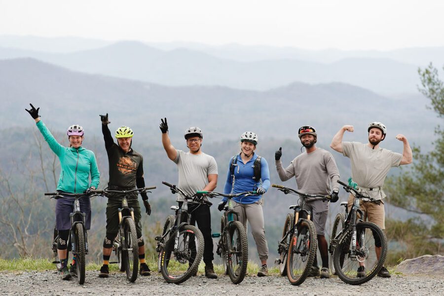 a group of friends celebrate a biking run