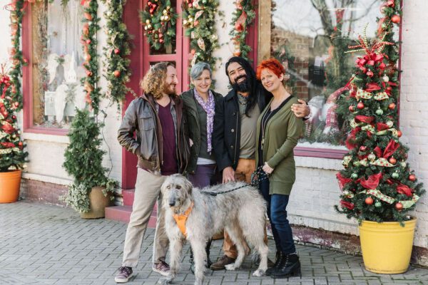 friends shopping with a dog during winter