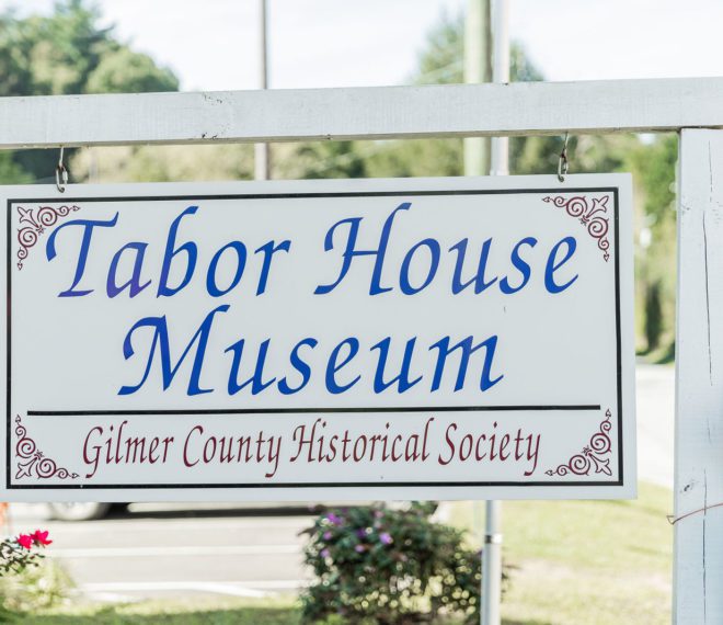 a sign for Tabor House Museum