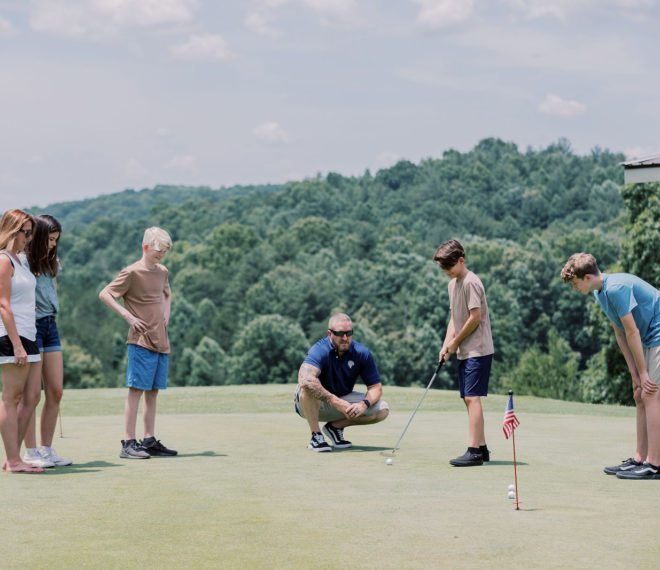 a group of people golfing