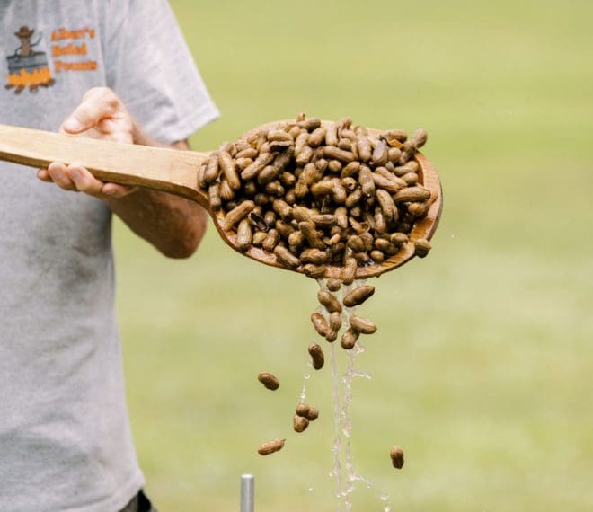 Mixing a batch of boiled peanuts