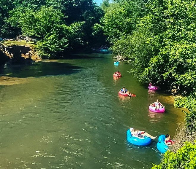 people tubing down a river