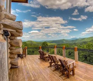 a cabin deck overlooking mountains