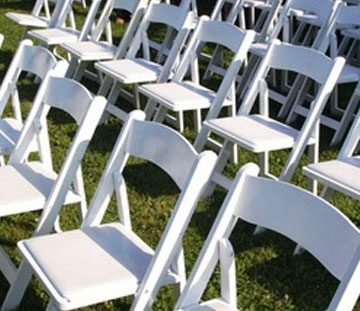 a bunch of chairs set up for a wedding